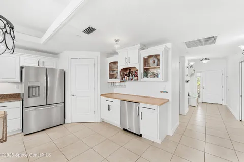 a kitchen with stainless steel appliances a refrigerator and a stove