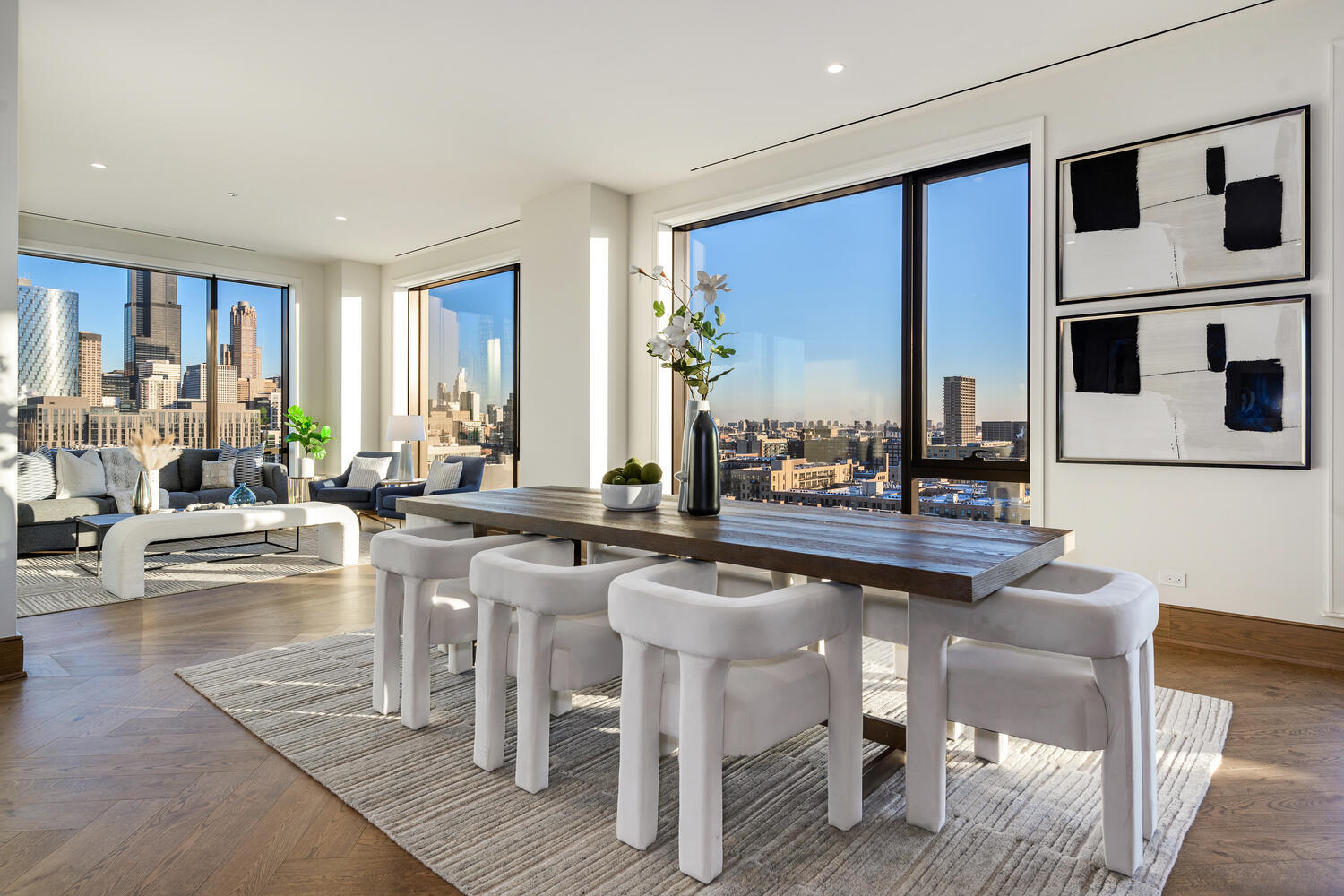 21 North May Street, Unit 1301 Chicago, IL 60607 - Photo 11 of 44 a kitchen with a dining table chairs and white cabinets