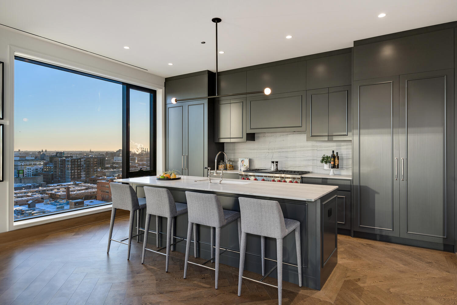 21 North May Street, Unit 1301 Chicago, IL 60607 - Photo 15 of 44 a kitchen with a table chairs stove and wooden floor