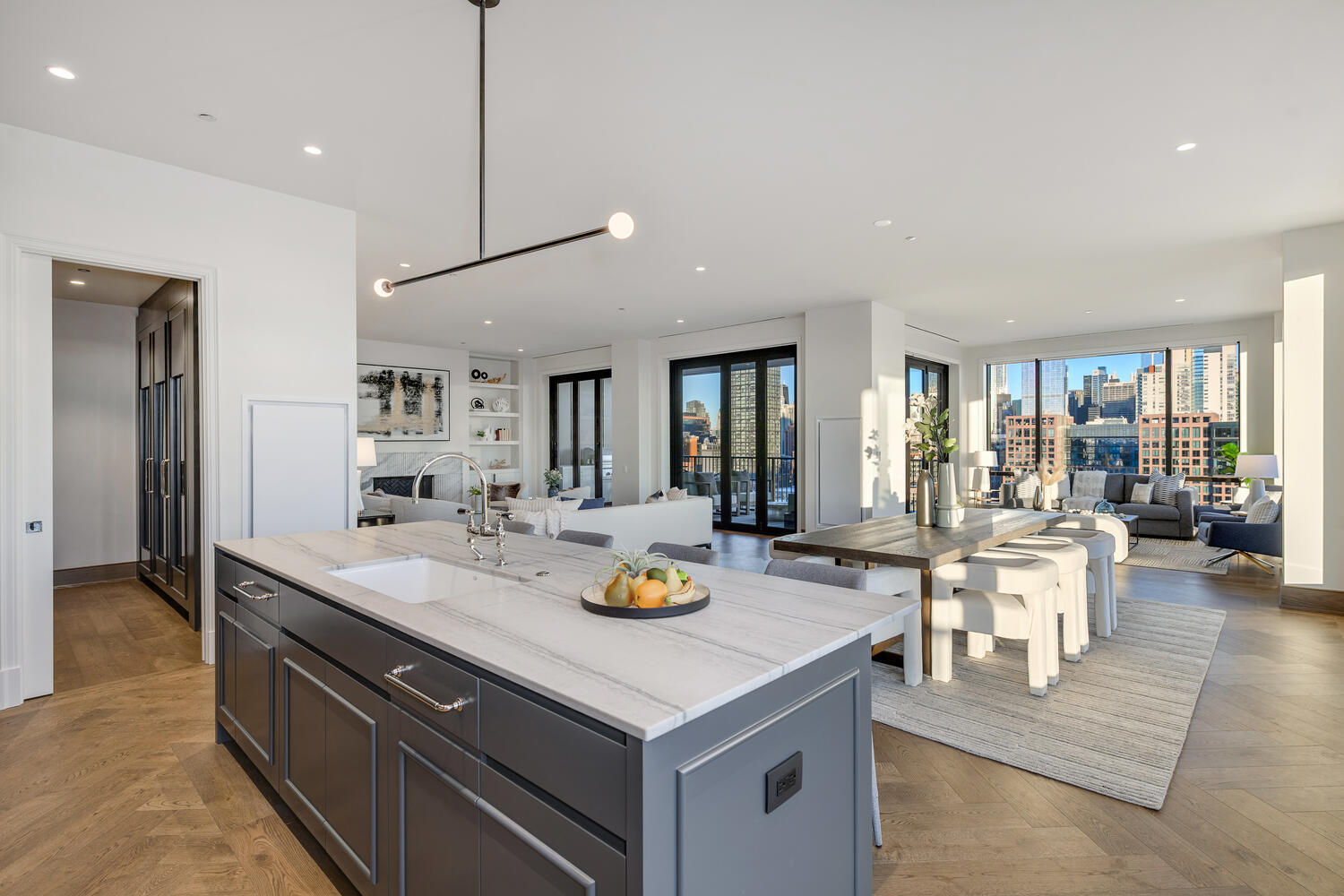 21 North May Street, Unit 1301 Chicago, IL 60607 - Photo 16 of 44 a living room with stainless steel appliances granite countertop a kitchen island a stove and a sink