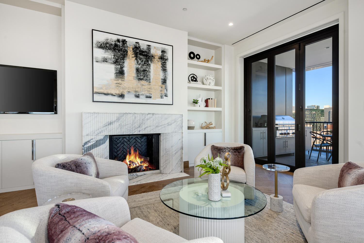 21 North May Street, Unit 1301 Chicago, IL 60607 - Photo 20 of 44 a living room with furniture a fireplace and a flat screen tv