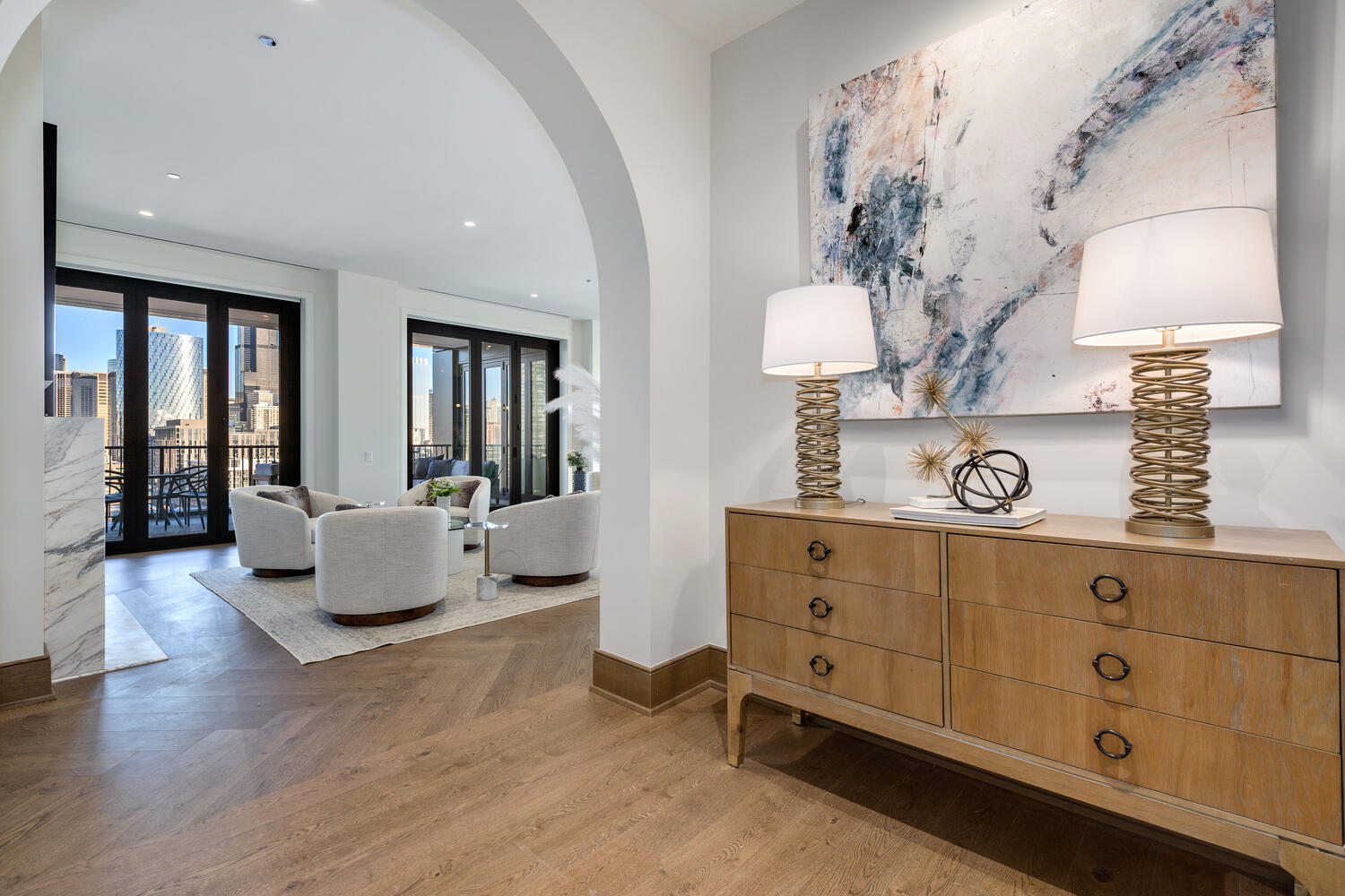 21 North May Street, Unit 1301 Chicago, IL 60607 - Photo 2 of 44 a spacious bedroom with a bed and a chandelier