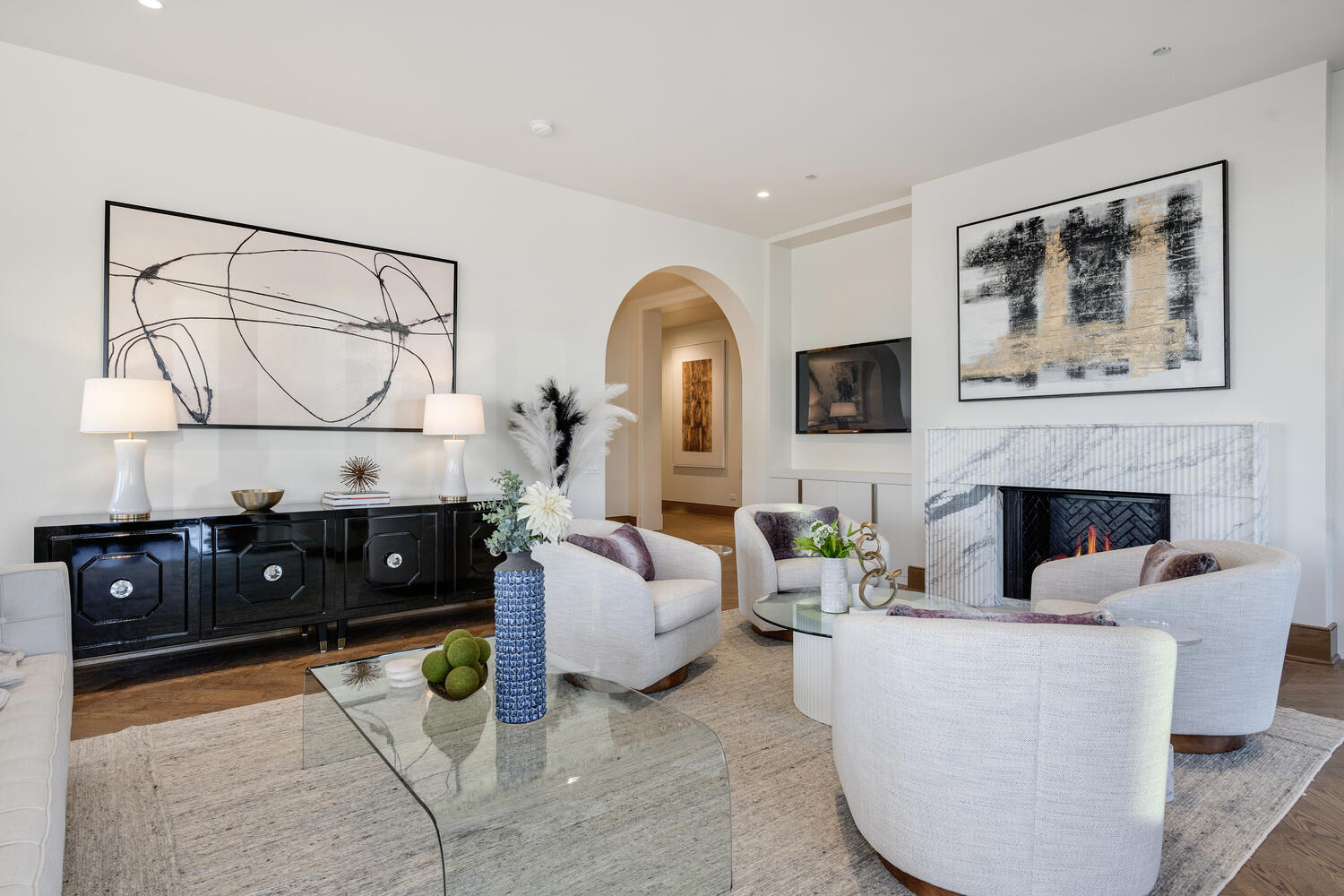 21 North May Street, Unit 1301 Chicago, IL 60607 - Photo 21 of 44 a living room with furniture a fireplace and a flat screen tv