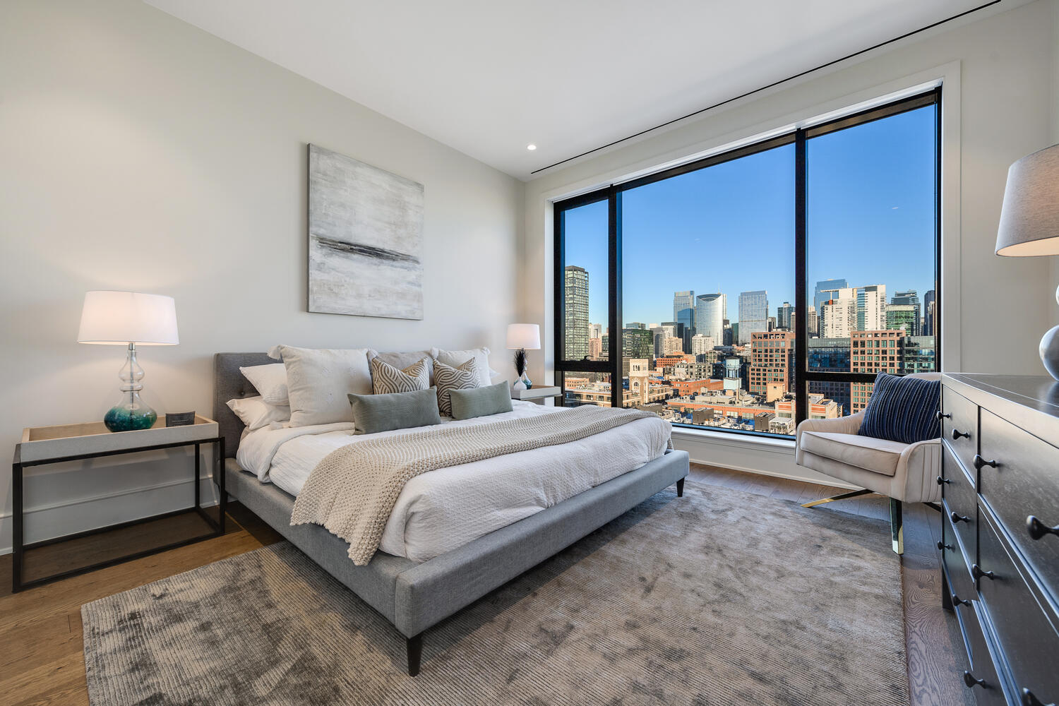 21 North May Street, Unit 1301 Chicago, IL 60607 - Photo 22 of 44 a bedroom with a large bed and a large window