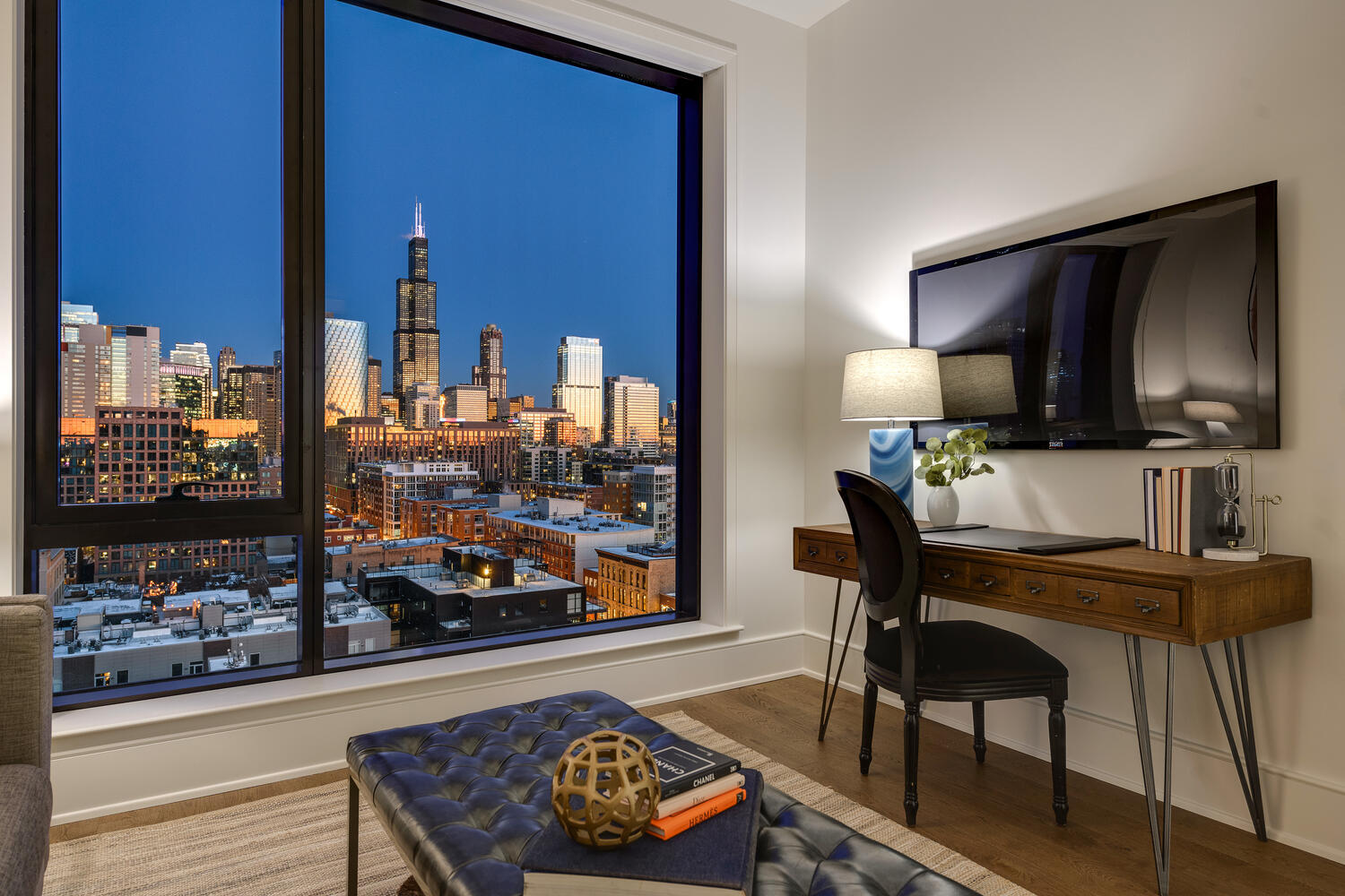 21 North May Street, Unit 1301 Chicago, IL 60607 - Photo 27 of 44 a living room with furniture and a flat screen tv