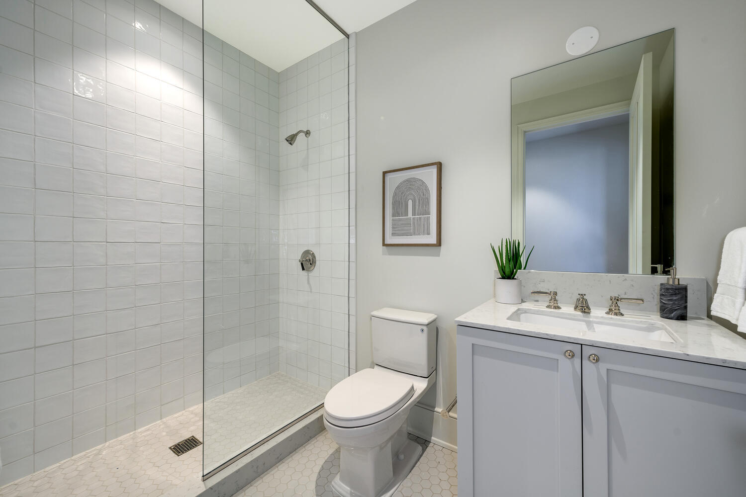 21 North May Street, Unit 1301 Chicago, IL 60607 - Photo 28 of 44 a bathroom with a sink toilet and shower