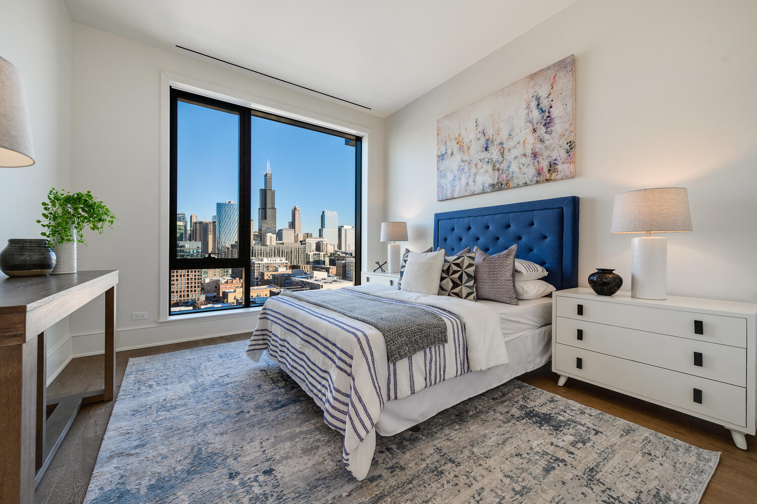 21 North May Street, Unit 1301 Chicago, IL 60607 - Photo 29 of 44 a bed room with bed and a window