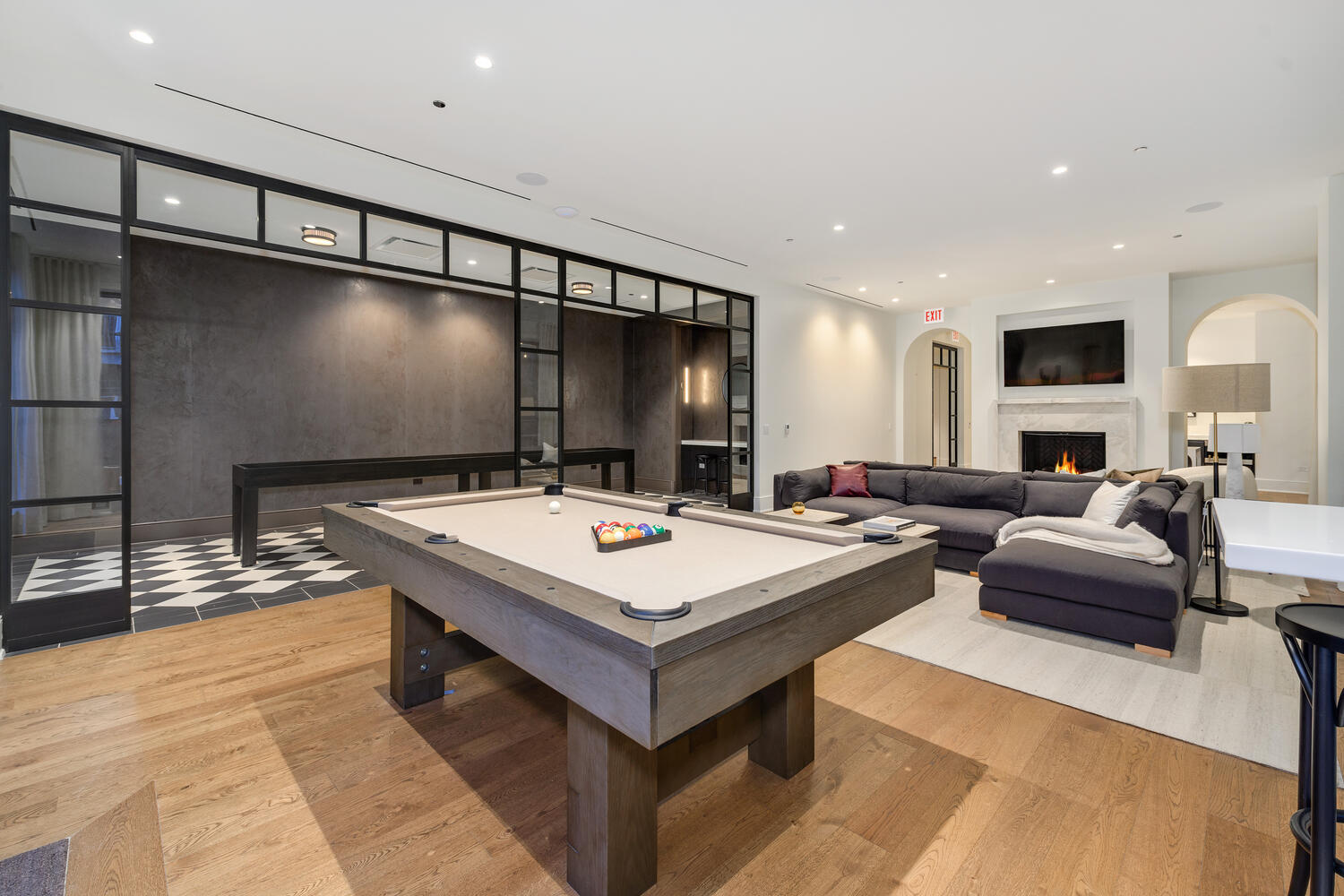 21 North May Street, Unit 1301 Chicago, IL 60607 - Photo 40 of 44 a living room with couches a table and kitchen view