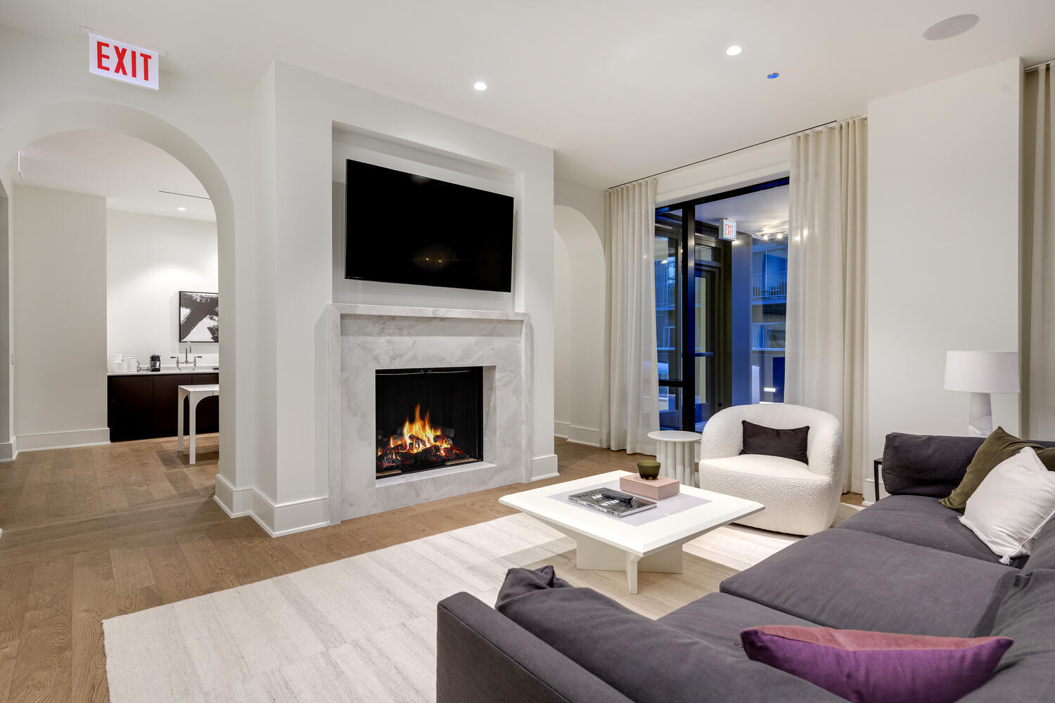 21 North May Street, Unit 1301 Chicago, IL 60607 - Photo 41 of 44 a living room with furniture a flat screen tv and a fireplace