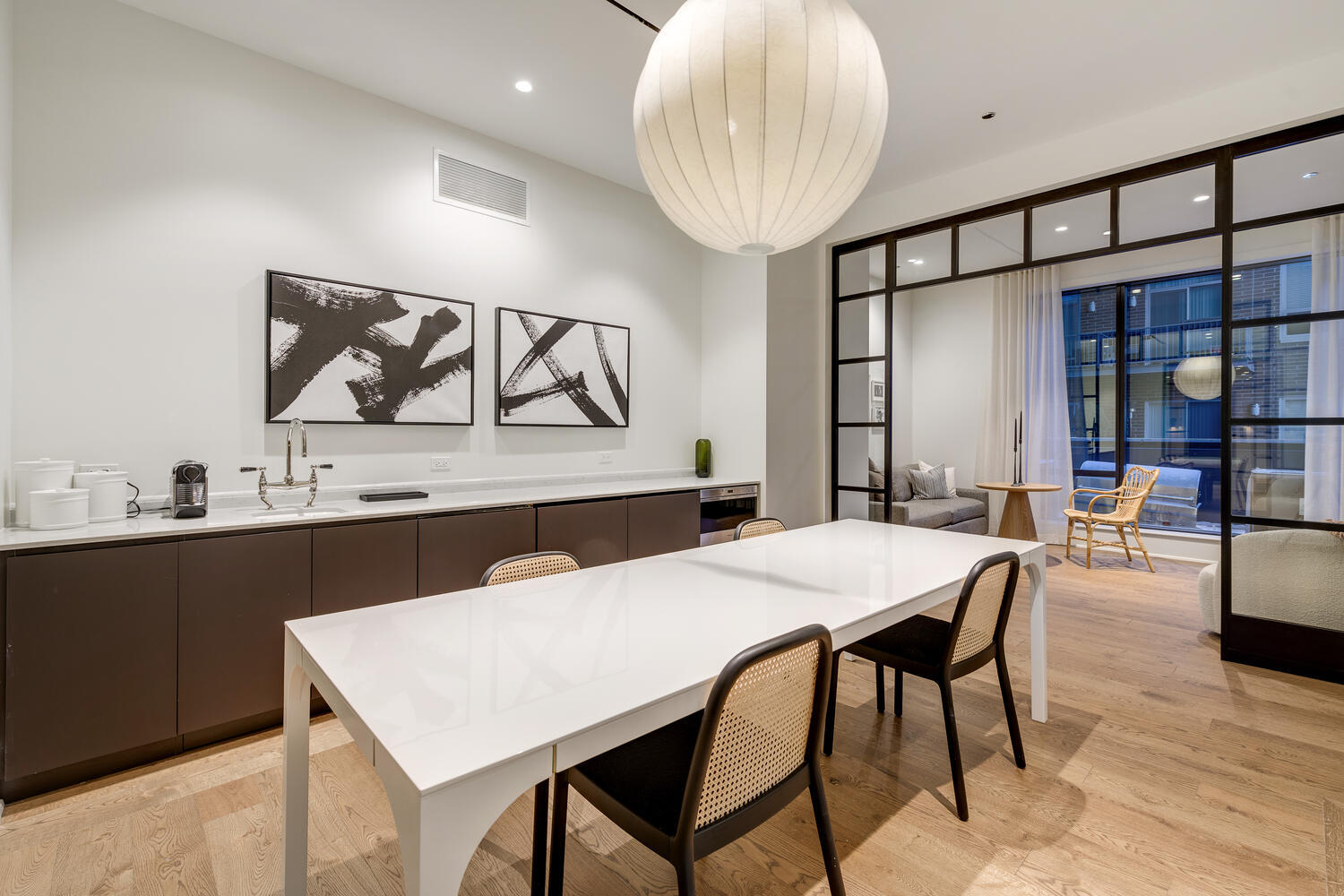 21 North May Street, Unit 1301 Chicago, IL 60607 - Photo 42 of 44 a kitchen with a table and chairs in it