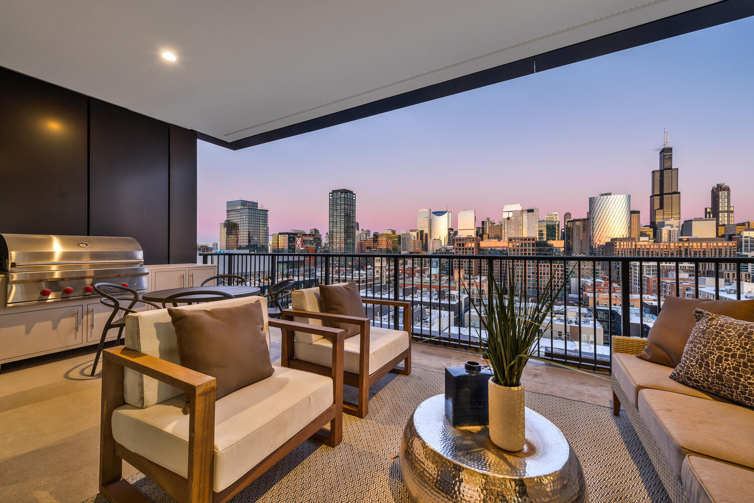 21 North May Street, Unit 1301 Chicago, IL 60607 - Photo 8 of 44 a living room with furniture a rug and a table