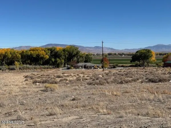 a view of a road with a building in the background