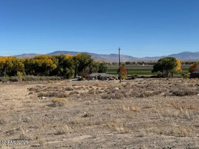 a view of a road with a building in the background