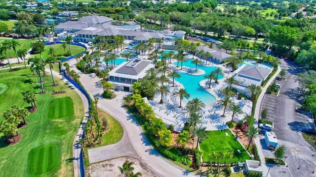 an aerial view of residential houses with outdoor space and street view