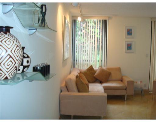 1405 Bridgewood Drive, Unit 1405 Boca Raton, FL 33434 - Photo 8 of 54 a living room with furniture and a window