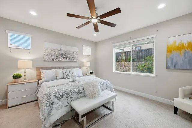 a bathroom with a double vanity sink mirror and shower