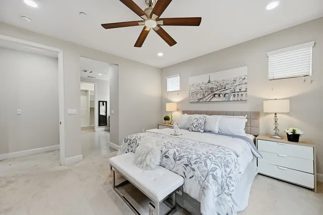 a bathroom with a sink mirror and toilet