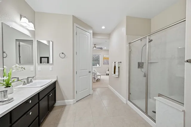 a bedroom with bed and a window