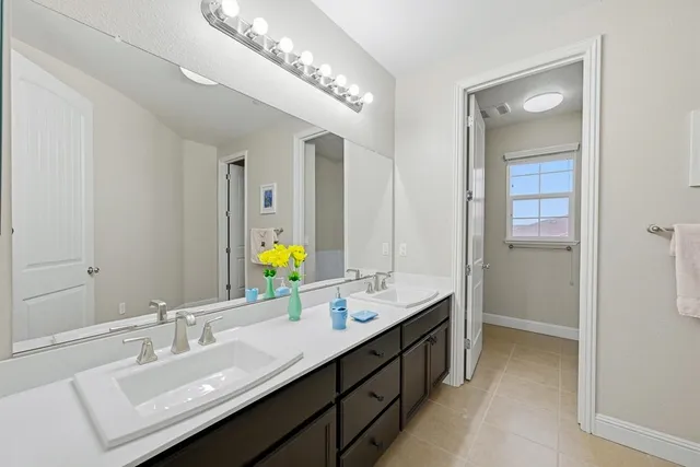 a view of a patio with couches table and chairs and potted plants