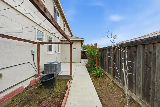 a view of a cars park in front of a building