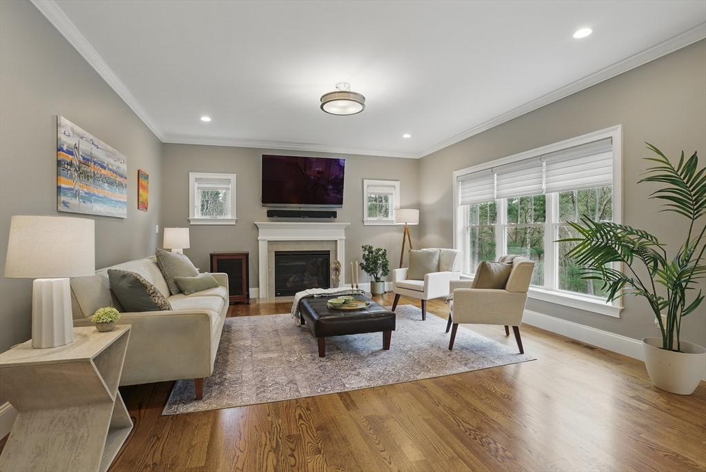 3 Willow Lane Bedford, MA 01730 - Photo 11 of 36 a living room with fireplace furniture and a flat screen tv
