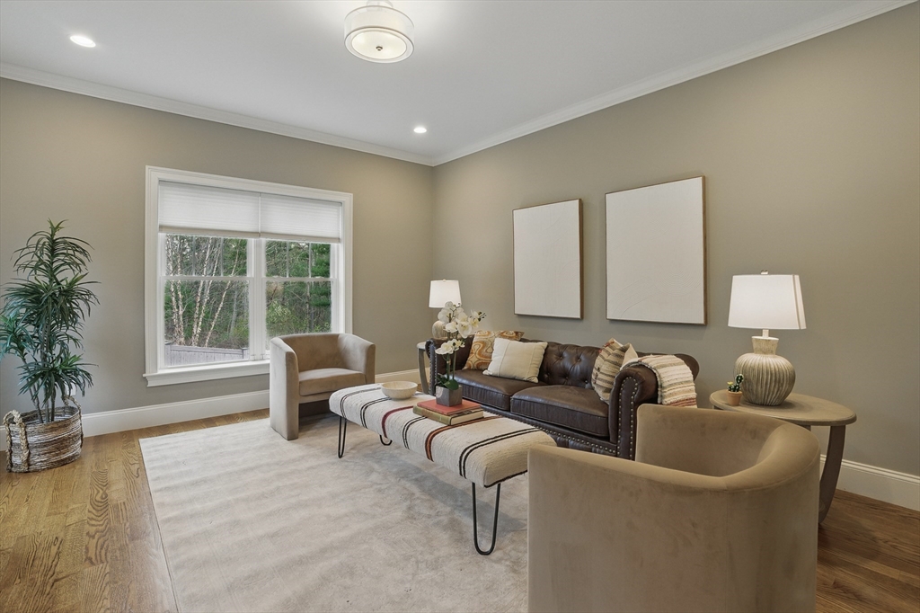 3 Willow Lane Bedford, MA 01730 - Photo 15 of 36 a living room with furniture and a large window