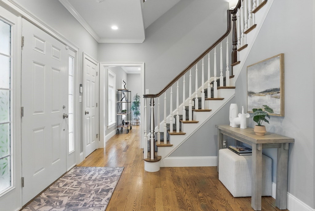 3 Willow Lane Bedford, MA 01730 - Photo 18 of 36 a view of entryway and hall with wooden floor