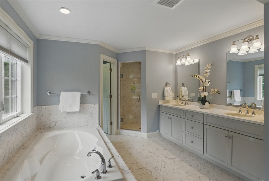 3 Willow Lane Bedford, MA 01730 - Photo 22 of 36 a spacious bathroom with a tub sink and mirror