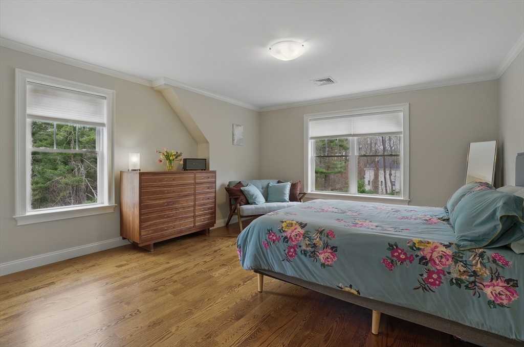 3 Willow Lane Bedford, MA 01730 - Photo 24 of 36 a bedroom with a bed next to a window