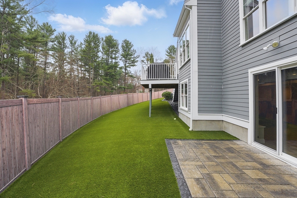 3 Willow Lane Bedford, MA 01730 - Photo 33 of 36 a view of a chair and table in backyard of the house