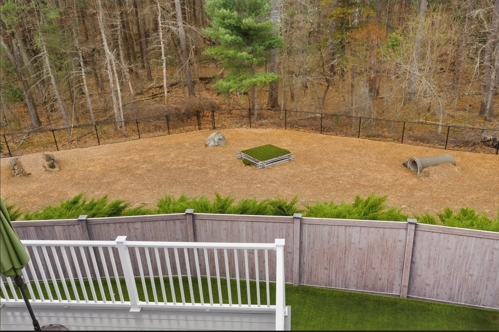 3 Willow Lane Bedford, MA 01730 - Photo 35 of 36 a view of a yard with wooden fence