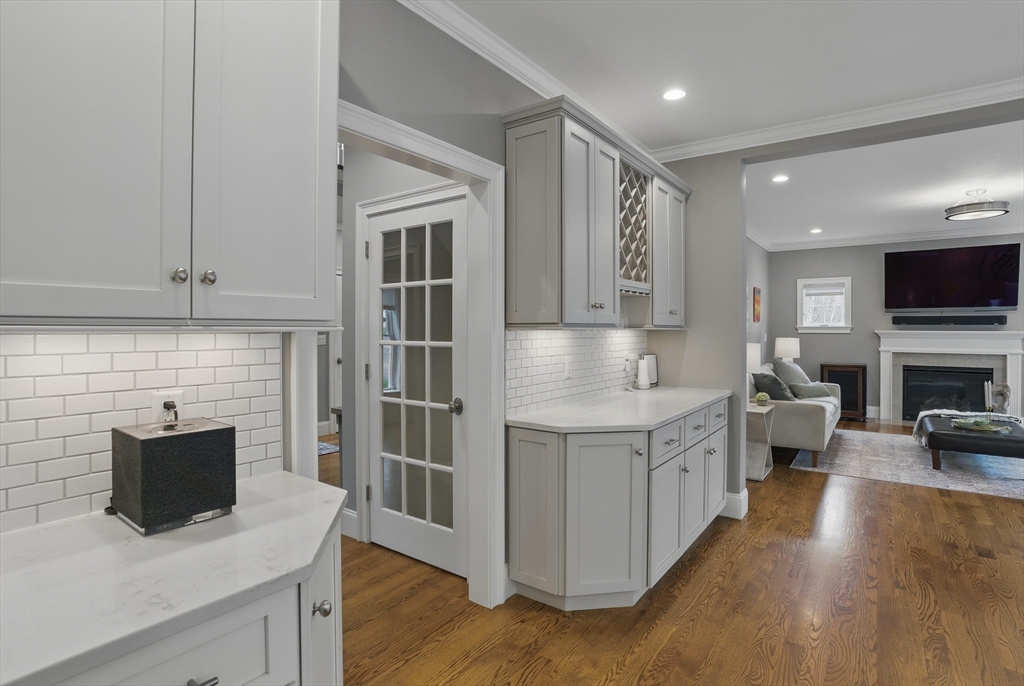 3 Willow Lane Bedford, MA 01730 - Photo 7 of 36 a kitchen with stainless steel appliances granite countertop a stove a sink and a microwave