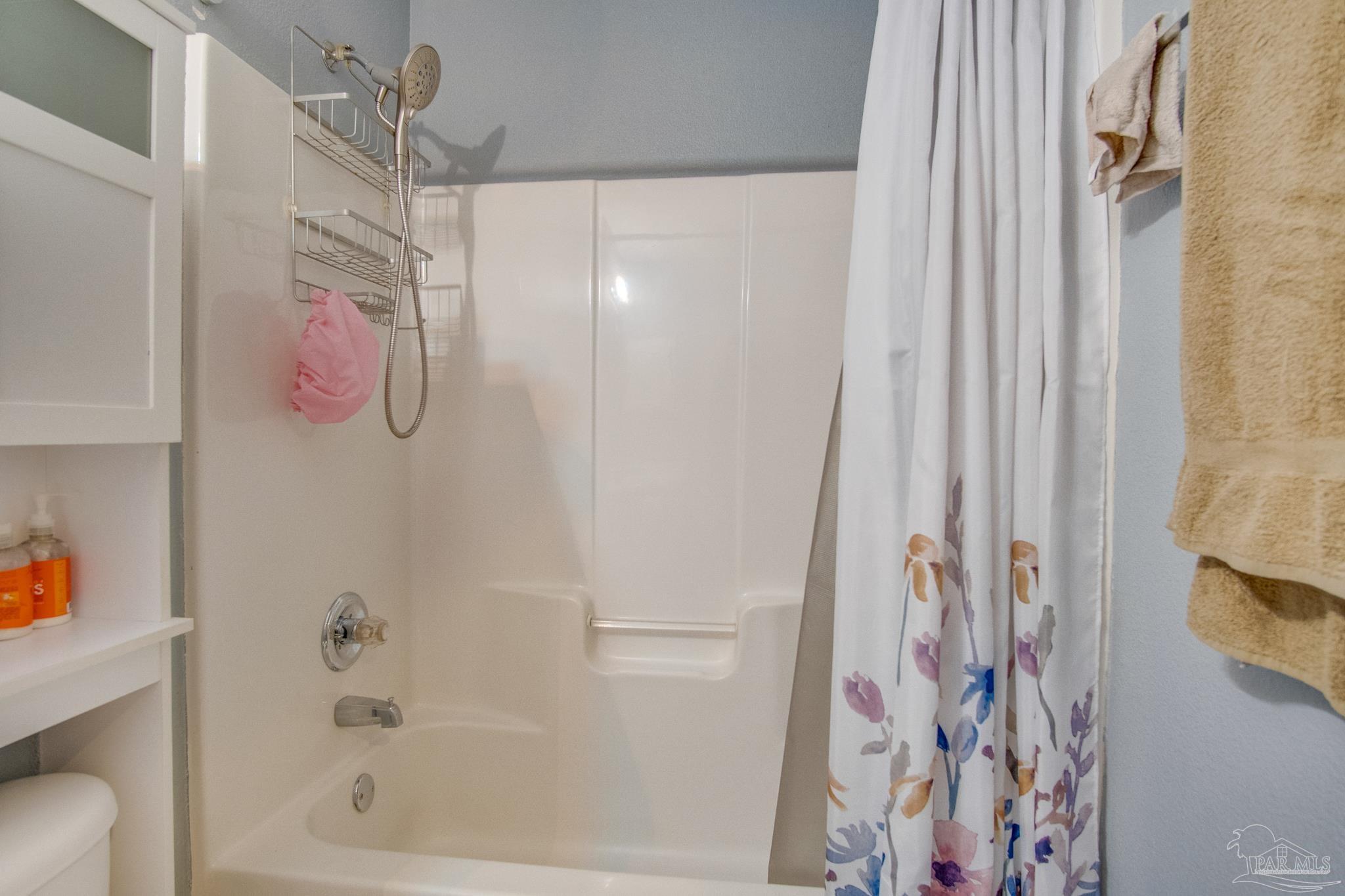 2005 Tujaques Place Pensacola, FL 32505 - Photo 25 of 30 a bathroom with a shower curtain