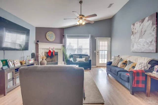 a living room with furniture and a flat screen tv