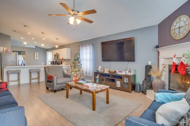 a living room with furniture and a flat screen tv