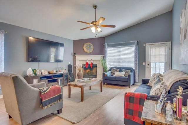 a living room with furniture and a flat screen tv