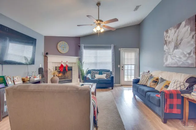 a view of a dining room with furniture and window