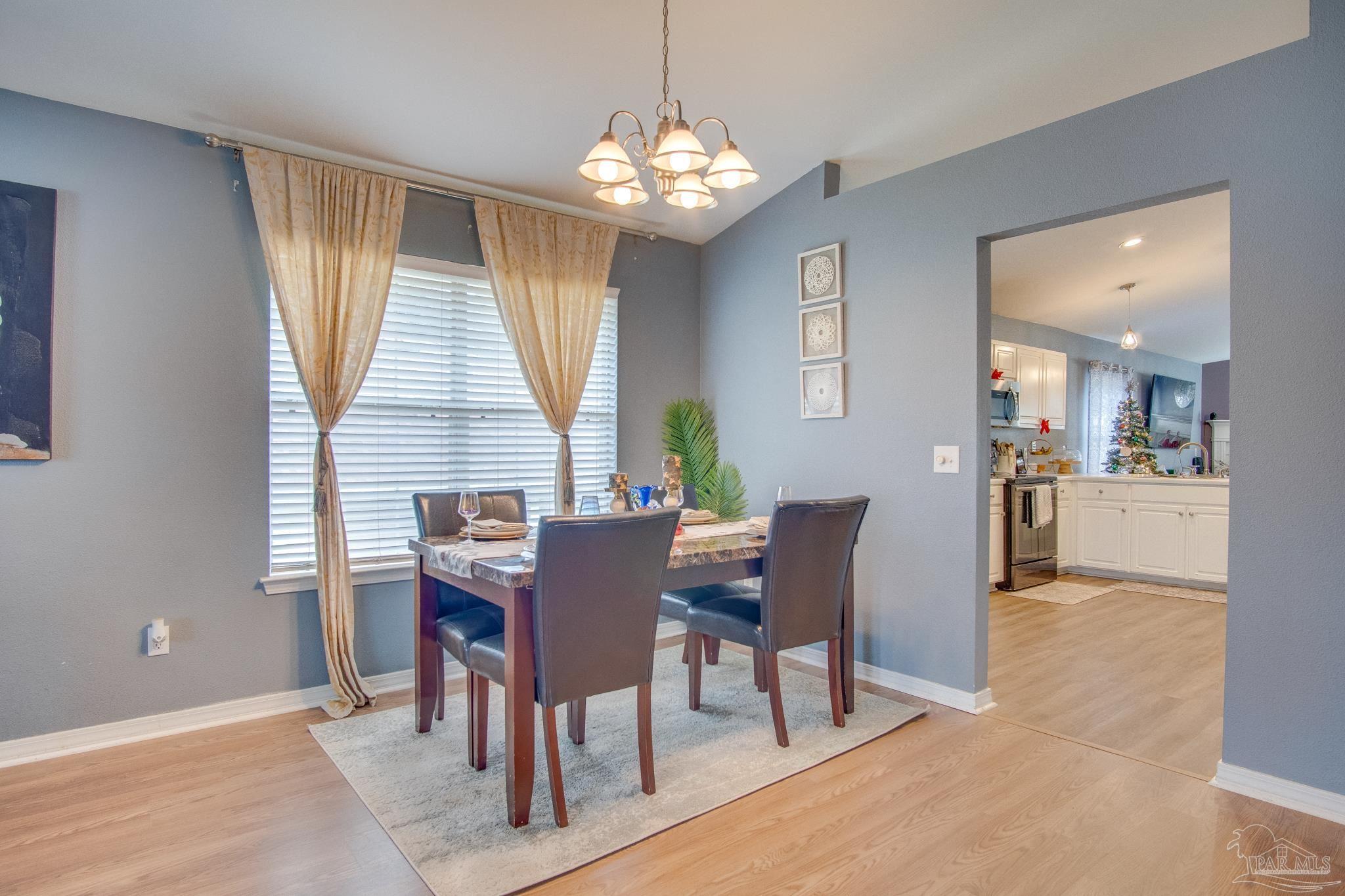 2005 Tujaques Place Pensacola, FL 32505 - Photo 10 of 30 a view of a dining room with furniture and window