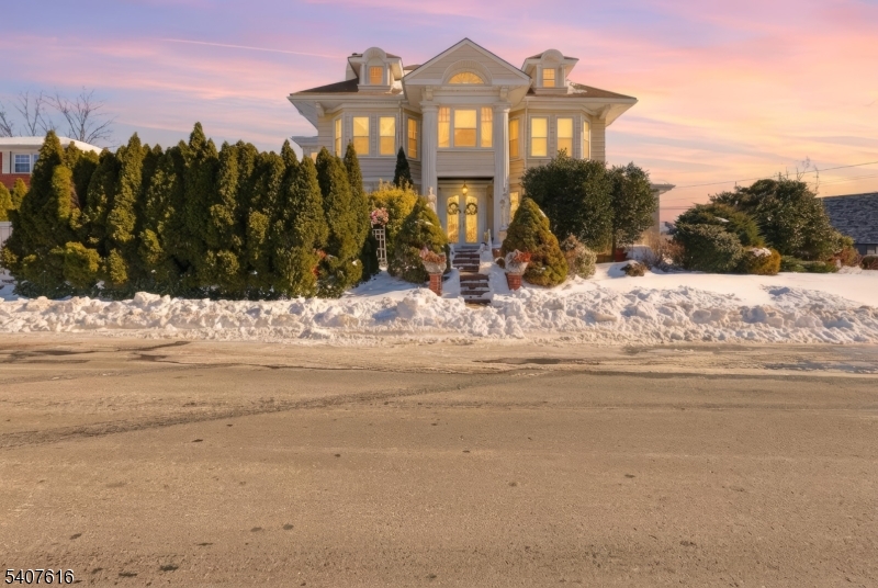 871 Colonia Road Elizabeth, NJ 07208 - Photo 1 of 12 a view of a house with snow on the road