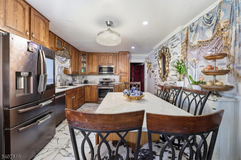 871 Colonia Road Elizabeth, NJ 07208 - Photo 2 of 12 a view of a dining room with furniture window and wooden floor