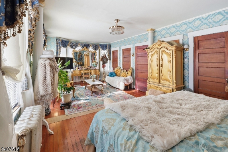 871 Colonia Road Elizabeth, NJ 07208 - Photo 8 of 12 a living room with furniture and a flat screen tv