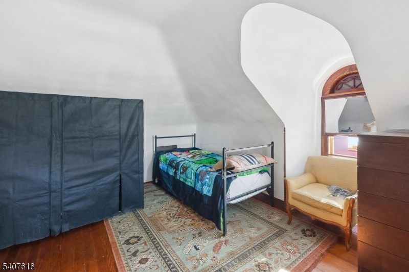871 Colonia Road Elizabeth, NJ 07208 - Photo 9 of 12 a living room with furniture and a wooden floor
