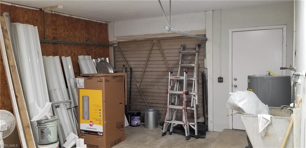 4201 23rd Place Southwest Naples, FL 34116 - Photo 17 of 19 a bathroom with a sink and a mirror