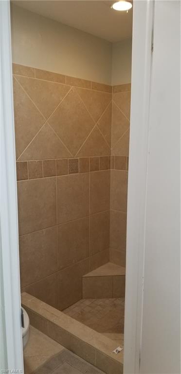 4201 23rd Place Southwest Naples, FL 34116 - Photo 18 of 19 a bathroom with a glass shower door
