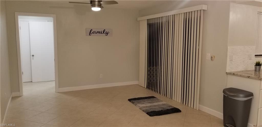 4201 23rd Place Southwest Naples, FL 34116 - Photo 5 of 19 an empty room with windows