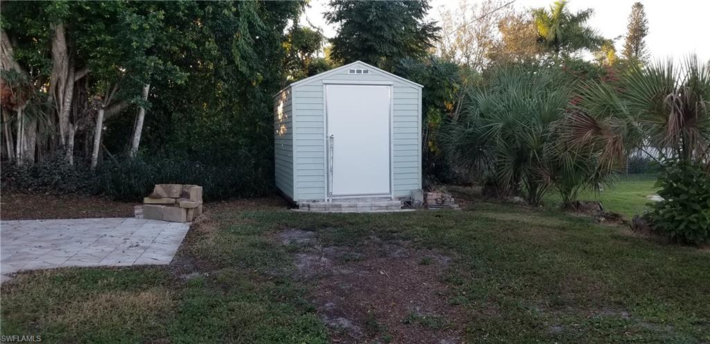 4201 23rd Place Southwest Naples, FL 34116 - Photo 10 of 19 a view of a back yard of the house
