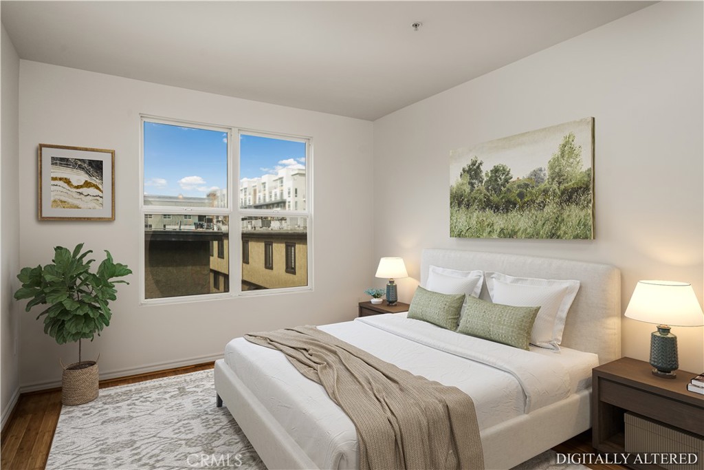 85 East Commonwealth Avenue, Unit 3D Alhambra, CA 91801 - Photo 16 of 30 a bedroom with a bed and a potted plant