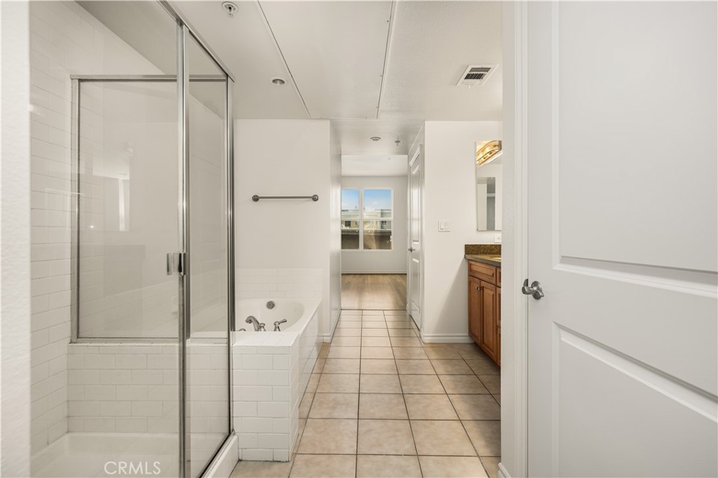 85 East Commonwealth Avenue, Unit 3D Alhambra, CA 91801 - Photo 20 of 30 a bathroom with a shower and a glass door