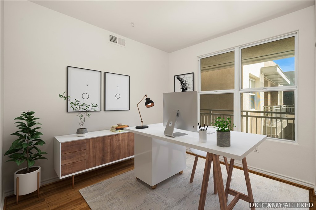 85 East Commonwealth Avenue, Unit 3D Alhambra, CA 91801 - Photo 21 of 30 a room with a table chairs and wooden floor