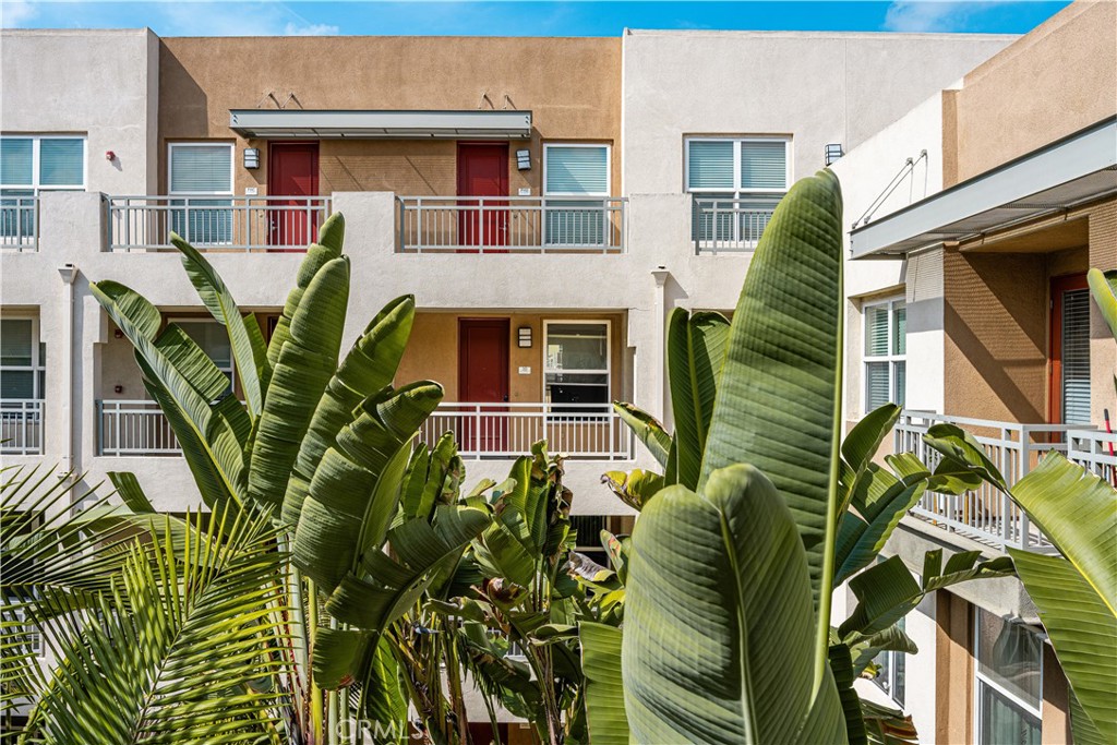 85 East Commonwealth Avenue, Unit 3D Alhambra, CA 91801 - Photo 27 of 30 a front view of a house with a plant